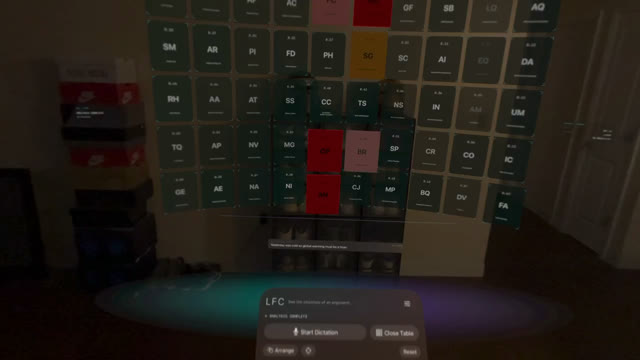 Colored reasoning cards arranged in a spatial table over a room.